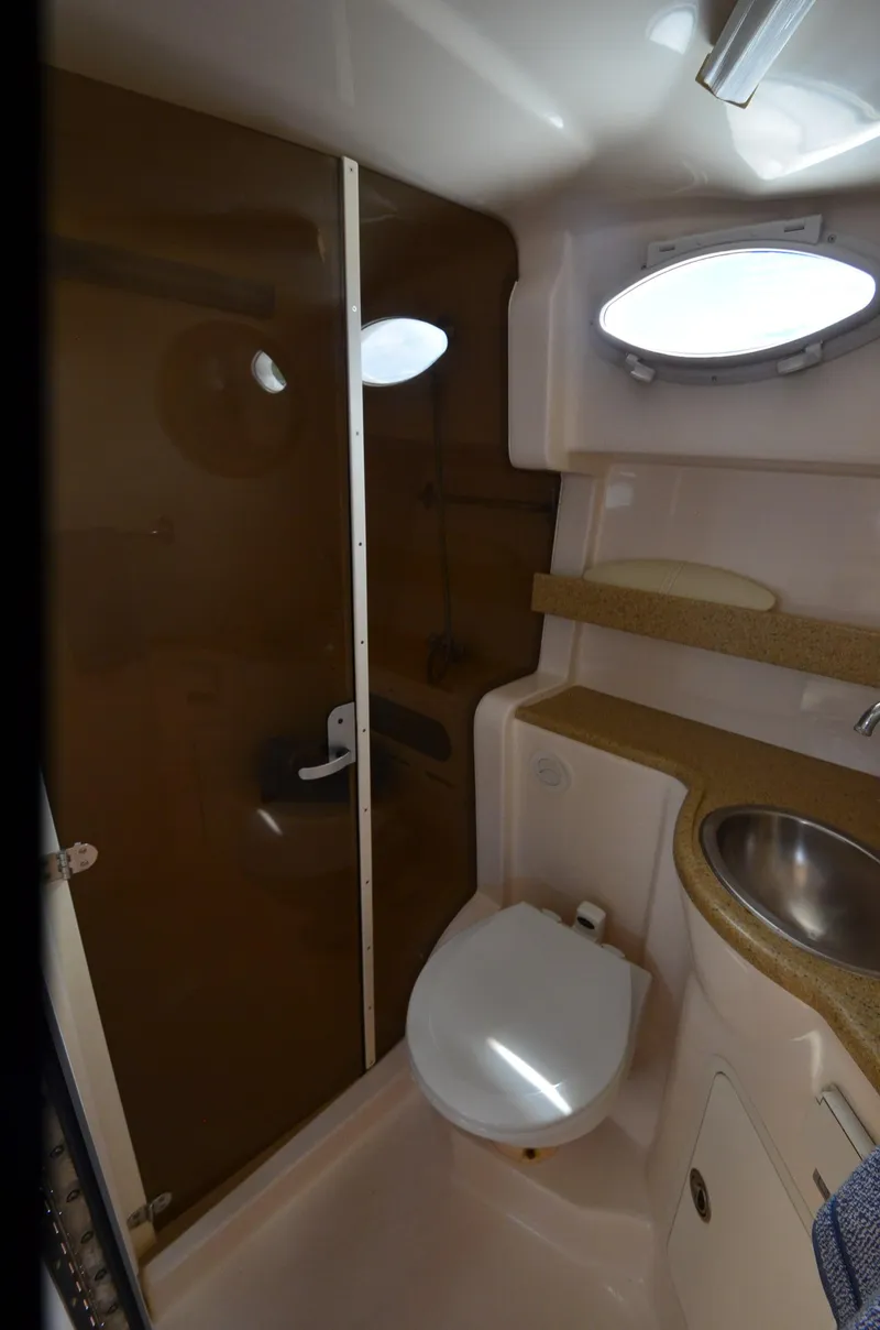 Slide: The Image of 2006 Rinker 342 Fiesta Vee bathroom with shower, toilet, and sink. - 30