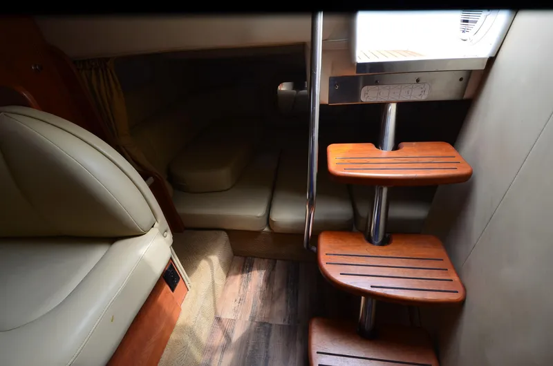 Slide: The Image of Interior of 2006 Rinker 342 Fiesta Vee with wooden steps and seating area. - 32