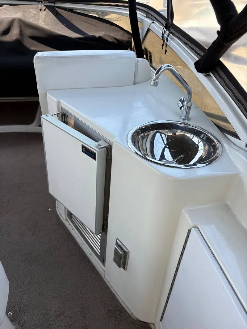 Slide: The Image of 2005 Carver 44 CPMY yacht kitchenette with sink and mini fridge. - 11