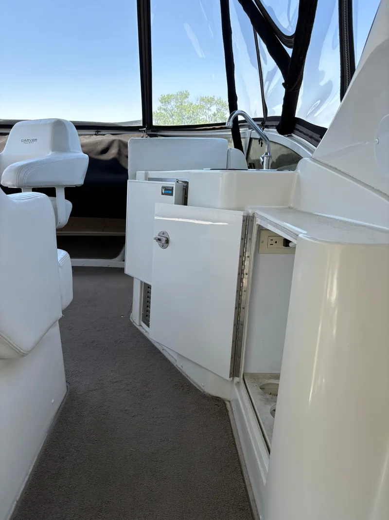 Slide: The Image of 2005 Carver 44 CPMY yacht interior with white seating and cabinetry. - 12