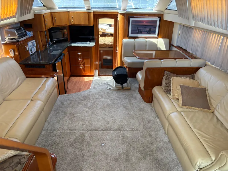 Slide: The Image of Luxurious interior of 2005 Carver 44 CPMY yacht with leather seating and modern amenities. - 16