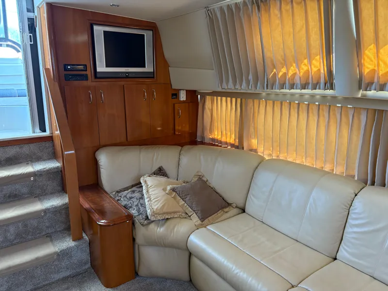 Slide: The Image of Luxurious interior of 2005 Carver 44 CPMY yacht with leather seating and TV. - 19
