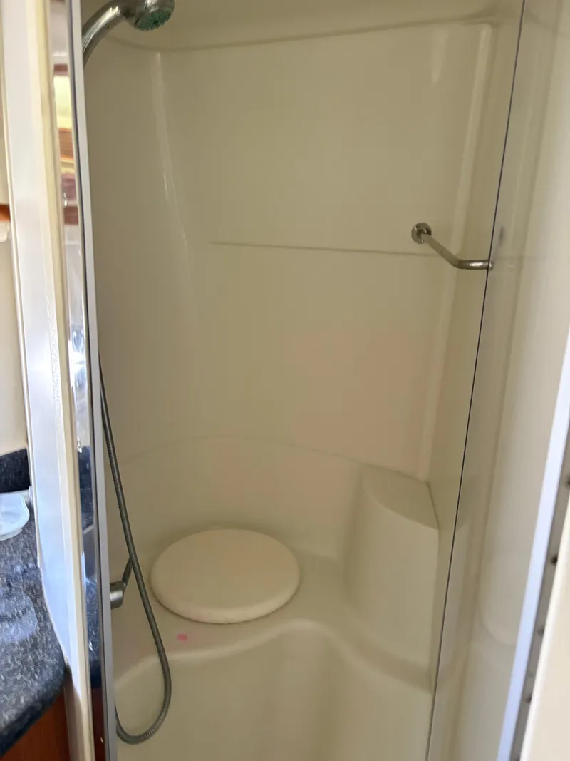Slide: The Image of Shower area in 2005 Carver 44 CPMY yacht with seat and handheld showerhead. - 25