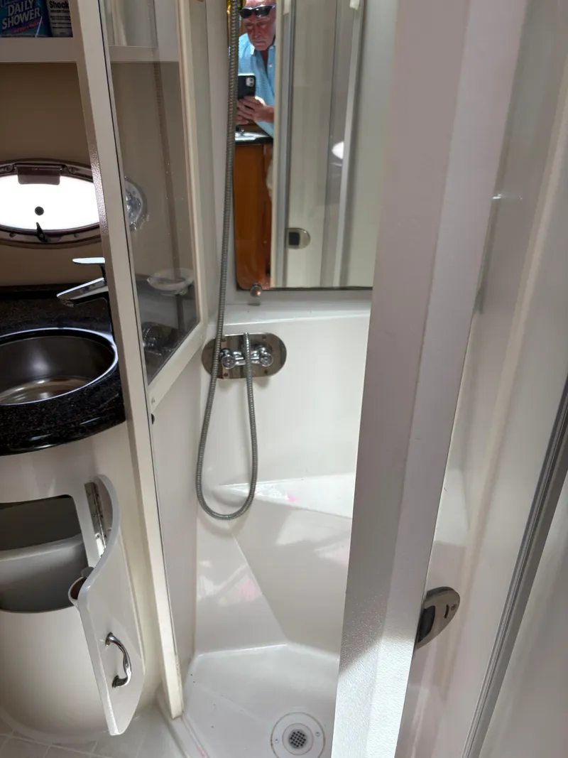 Slide: The Image of 2005 Carver 44 CPMY yacht bathroom with shower and sink. - 27