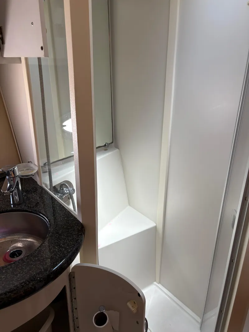 Slide: The Image of 2005 Carver 44 CPMY bathroom with shower and sink. - 28