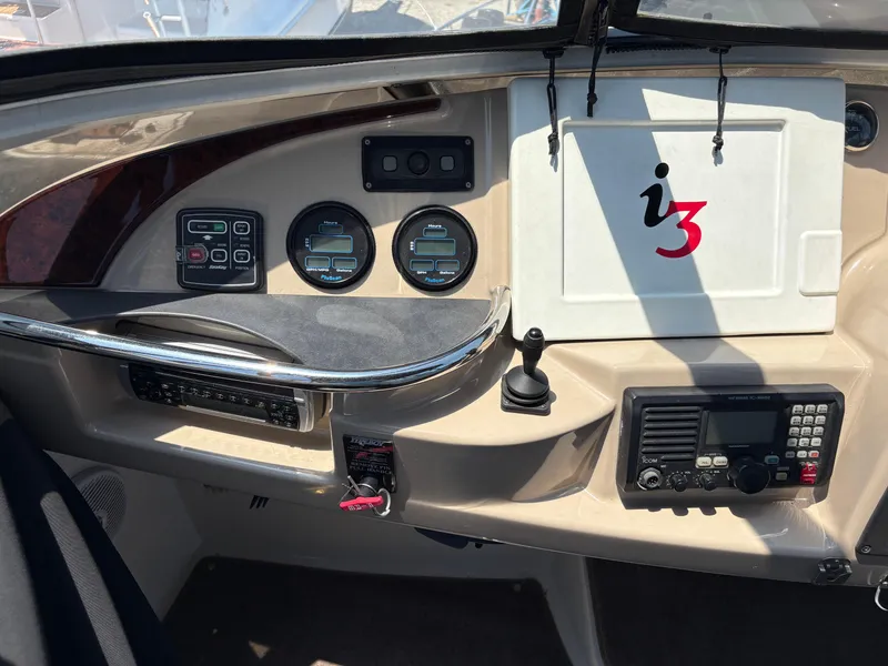 Slide: The Image of Control panel of a 2005 Carver 44 CPMY yacht with gauges and navigation equipment. - 5