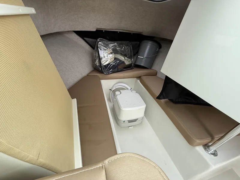 Slide: The Image of Interior of 2019 Parker 2320 Sport Cabin with seating and portable toilet. - 22