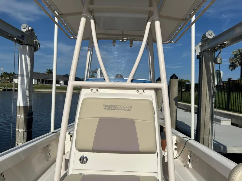 Slide: The Image of 2019 Pathfinder 2200 CC boat docked by a calm waterfront. - 11
