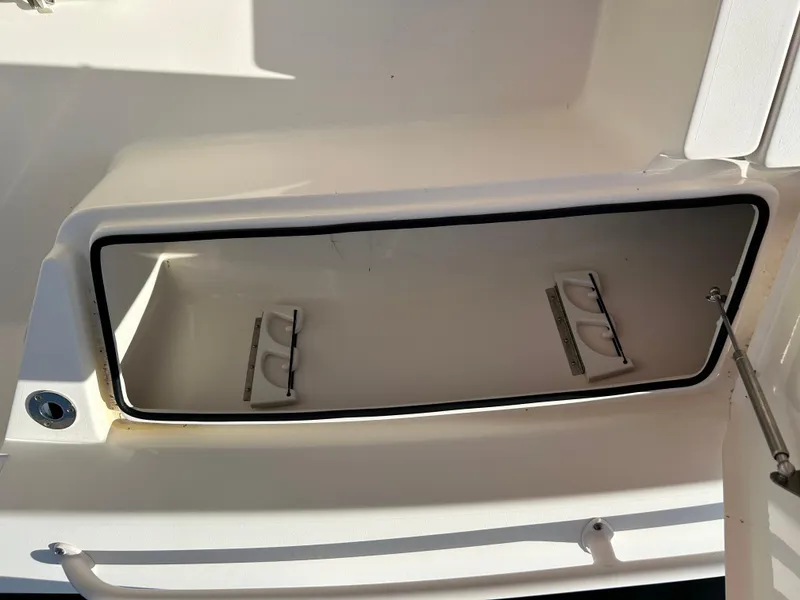 Slide: The Image of Open storage compartment on a 2019 Pathfinder 2200 CC boat. - 13