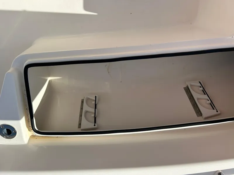 Slide: The Image of Storage compartment of a 2019 Pathfinder 2200 CC boat, open and empty. - 14