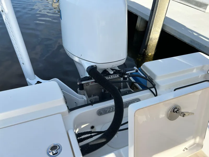 Slide: The Image of 2019 Pathfinder 2200 CC boat engine and deck near dock. - 21