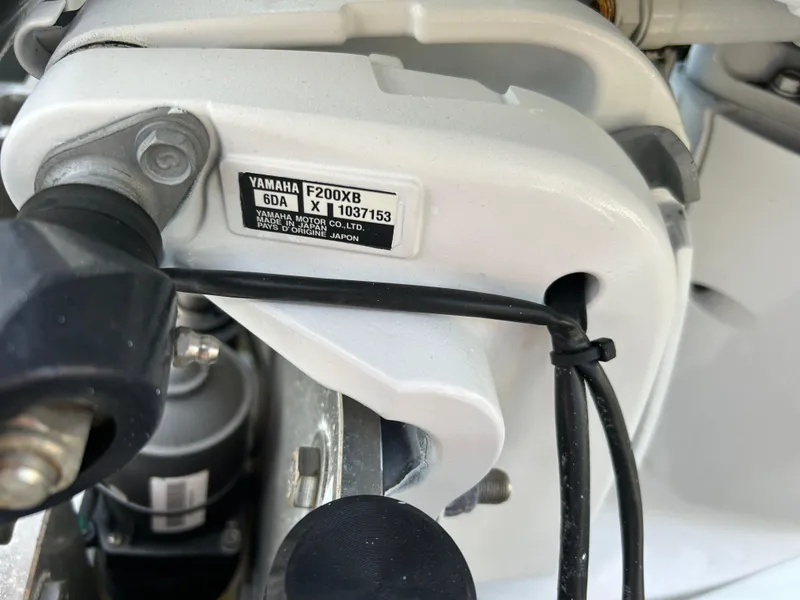 Slide: The Image of Close-up of a Yamaha F200XB engine part on a 2019 Pathfinder 2200 CC boat. - 23