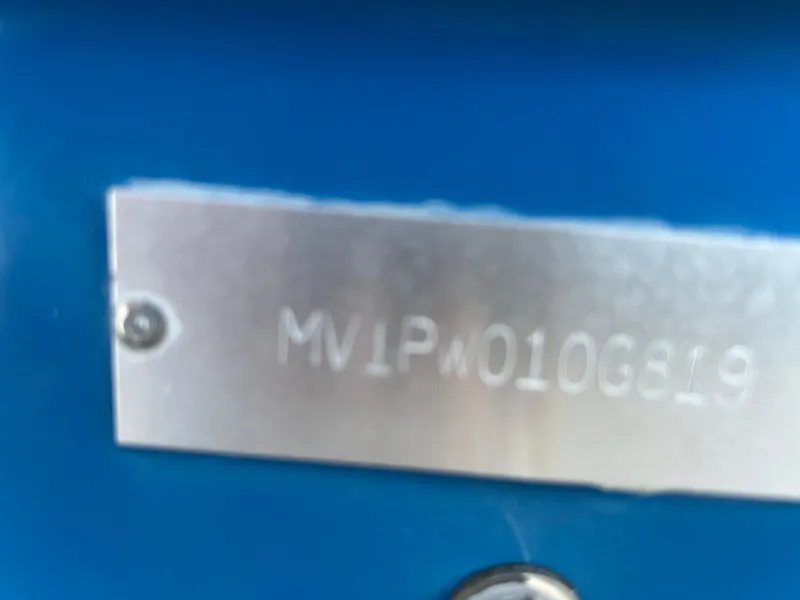 Slide: The Image of 2019 Pathfinder 2200 CC identification plate with serial number on blue background. - 24
