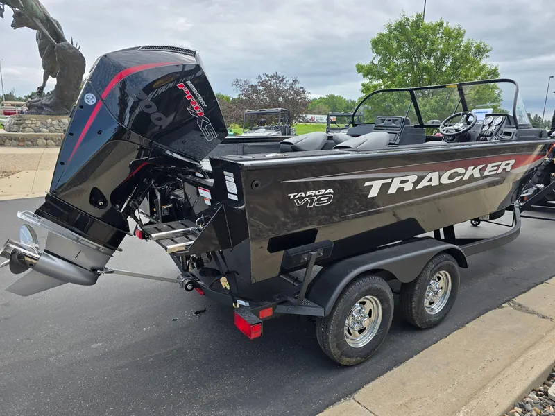 Slide: The Image of 2025 Tracker Targa V-19 WT boat on trailer, featuring powerful outboard motor. - 4