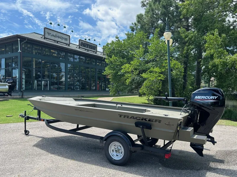 The Image of 2025 Tracker Grizzly 1654 T Sportsman boat with Mercury engine outside dealership. - 0