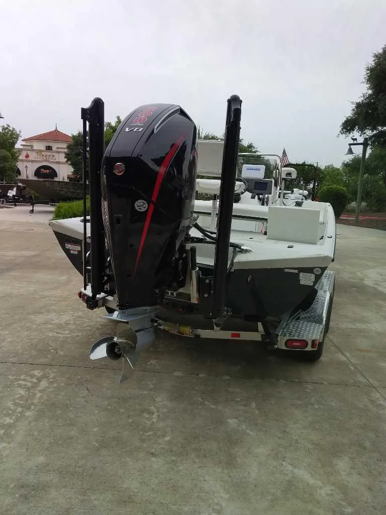 Slide: The Image of 2025 Ranger RB210 boat with powerful outboard motor on a trailer. - 2