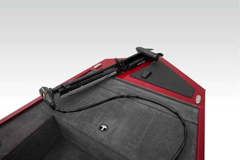 Slide: The Image of Open storage compartment on 2025 Tracker Panfish 17 boat, featuring a metallic interior. - 10