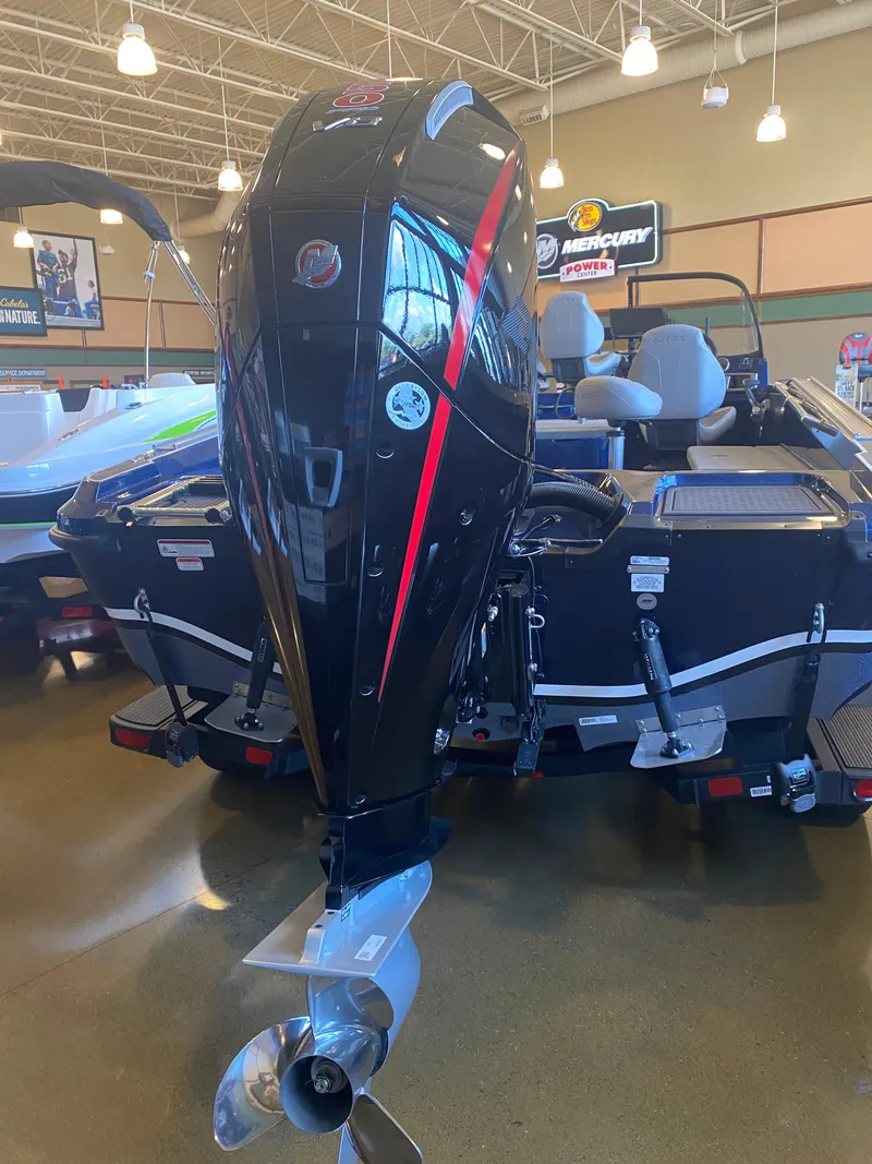 Slide: The Image of 2025 Nitro ZV20 Pro boat with powerful Mercury outboard motor in showroom. - 2