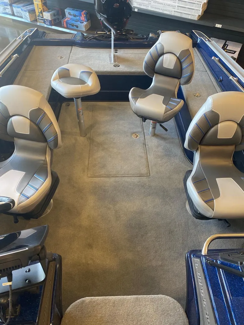 Slide: The Image of 2025 Nitro ZV20 Pro boat interior with four cushioned seats and carpeted flooring. - 6