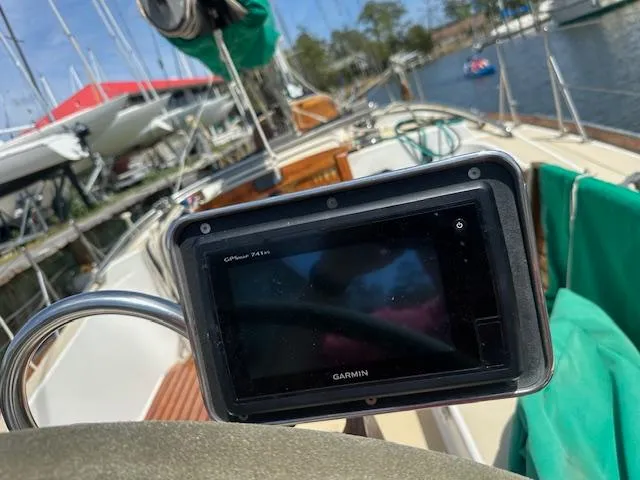 Slide: The Image of Garmin GPS on 1978 Tartan 37 sailboat, docked in marina with other boats. - 11