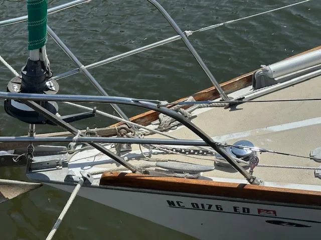 Slide: The Image of 1978 Tartan 37 sailboat bow with rigging and water background. - 2