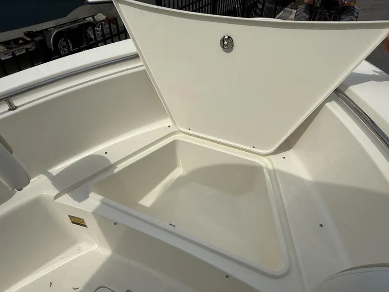 Slide: The Image of 2025 Bulls Bay 230 Center Console boat with open storage compartment. - 6