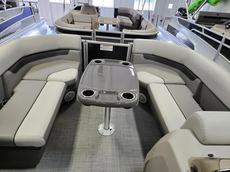 Slide: The Image of 2025 Princecraft Vectra 19 L pontoon boat interior with gray seating and table. - 4