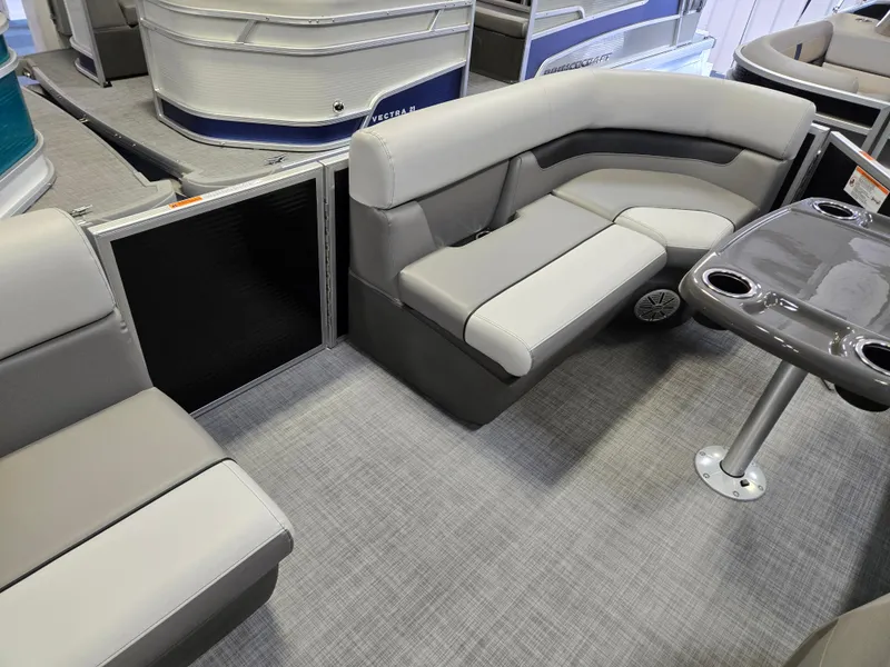 Slide: The Image of 2025 Princecraft Vectra 19 L pontoon boat interior with gray seating and table. - 5
