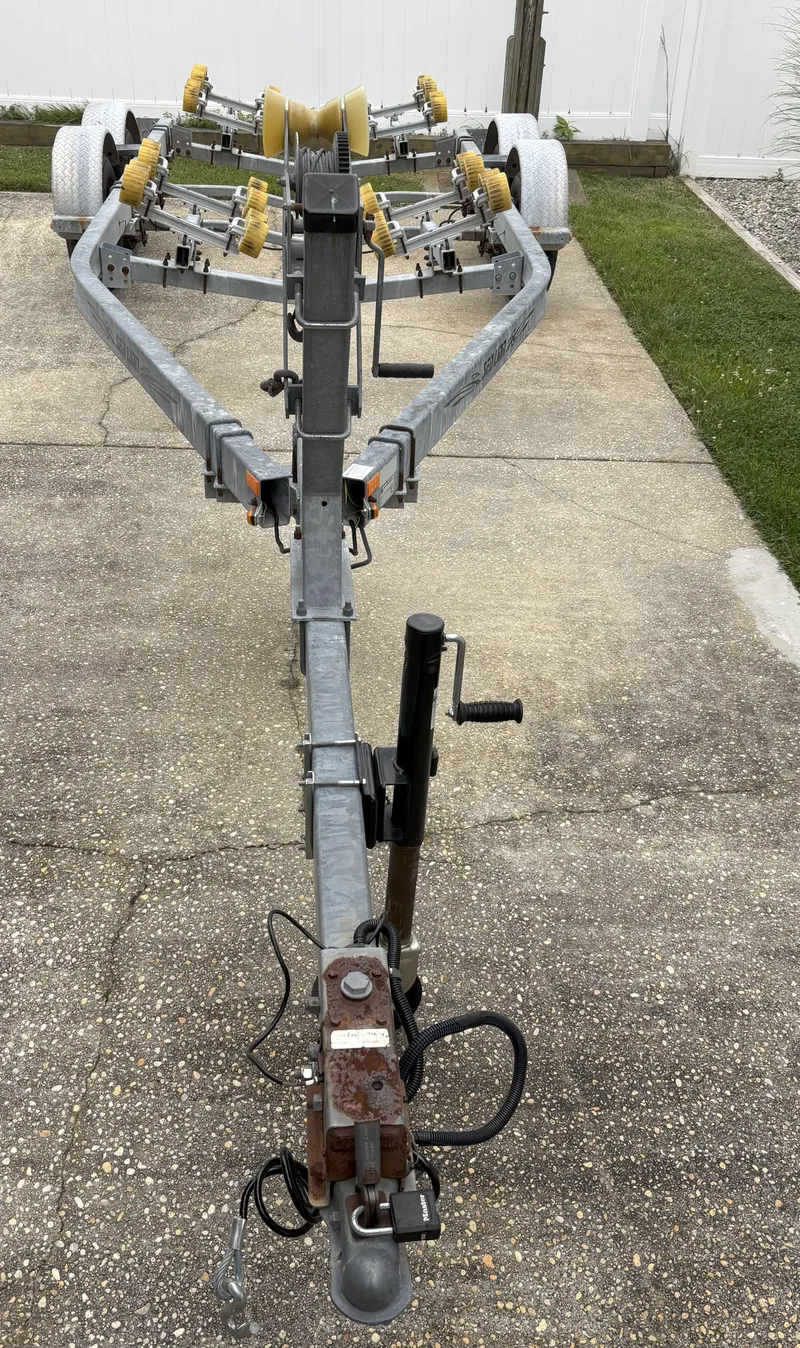 Slide: The Image of Boat trailer for 1989 Parker 2310 Walkaround, parked on concrete driveway. - 9