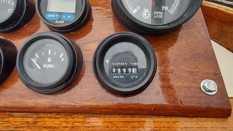 Slide: The Image of Dashboard of 1988 Shamrock 220 Predator showing fuel gauge and elapsed time meter. - 11