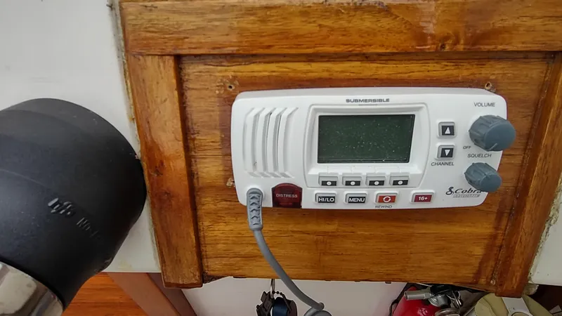 Slide: The Image of Marine radio on 1988 Shamrock 220 Predator boat, mounted on wooden panel. - 12