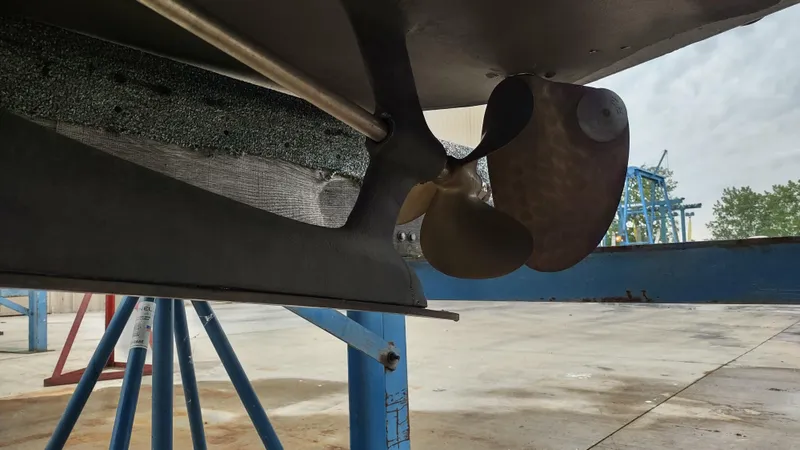 Slide: The Image of Propeller and rudder of 1988 Shamrock 220 Predator boat on dry dock. - 15