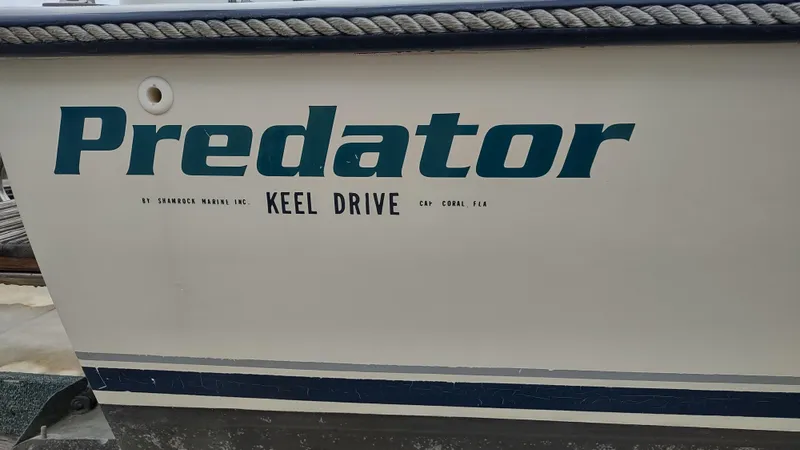 Slide: The Image of 1988 Shamrock 220 Predator boat with "Keel Drive" text on the side. - 16
