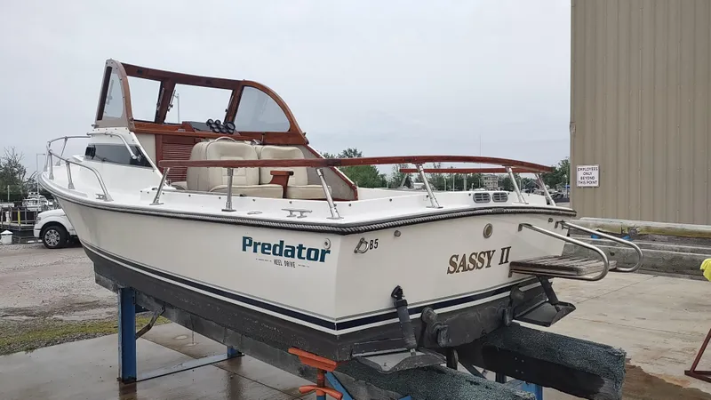 Slide: The Image of 1988 Shamrock 220 Predator boat named "Sassy II" on a stand, side view. - 3