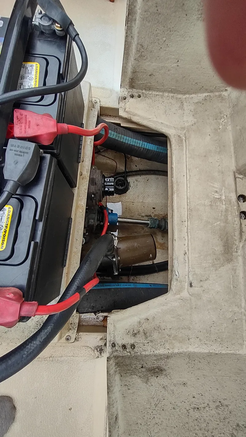 Slide: The Image of 1988 Shamrock 220 Predator engine compartment with batteries and wiring visible. - 9