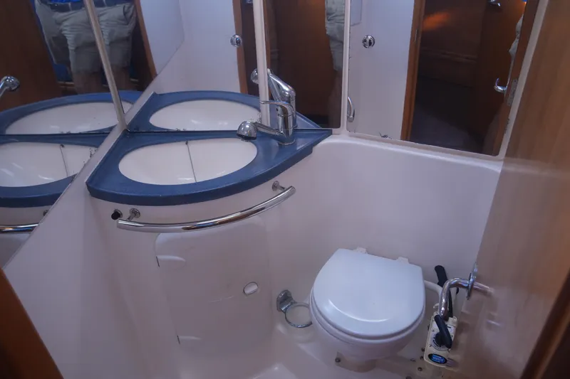 Slide: The Image of Bathroom interior of 2007 Bavaria 37 Cruiser yacht, featuring sink and toilet. - 19
