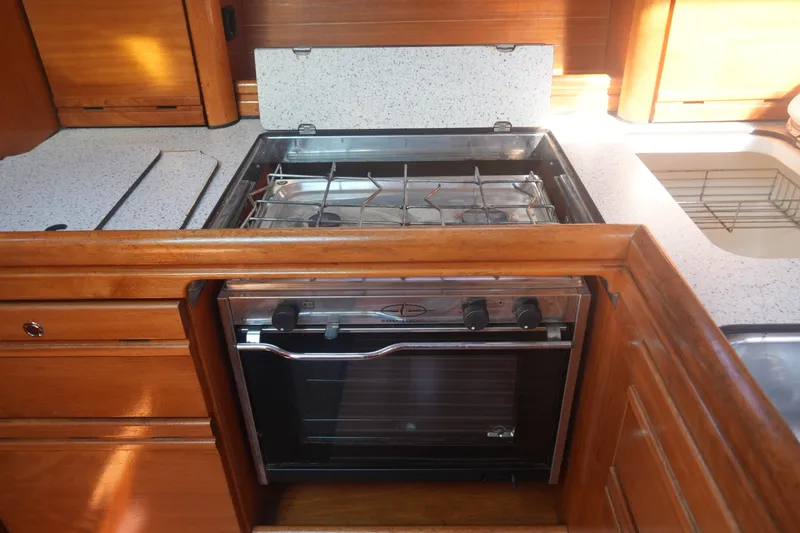 Slide: The Image of Wooden yacht kitchen with stove and sink, Bavaria 37 Cruiser, 2007 model. - 25