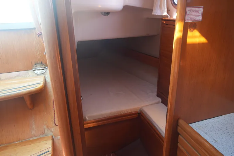 Slide: The Image of Cozy cabin interior of 2007 Bavaria 37 Cruiser sailboat with wooden finish. - 26