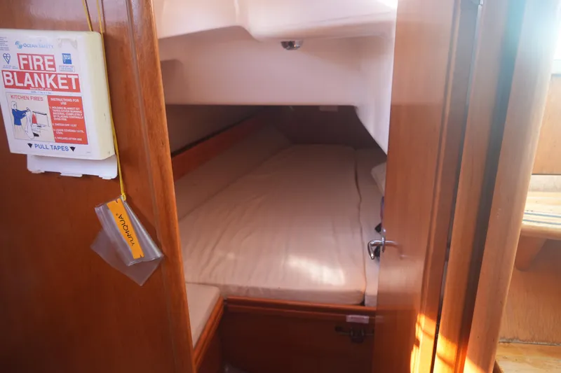 Slide: The Image of Cozy cabin interior of 2007 Bavaria 37 Cruiser with fire blanket on wall. - 27
