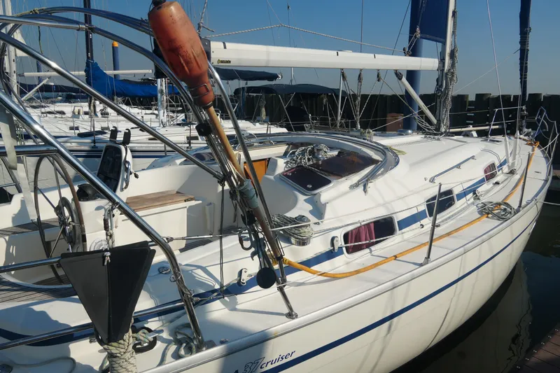 Slide: The Image of 2007 Bavaria 37 Cruiser sailboat docked at marina, featuring sleek design and spacious deck. - 4