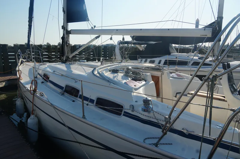Slide: The Image of 2007 Bavaria 37 Cruiser sailboat docked at marina, featuring sleek design and rigging. - 6