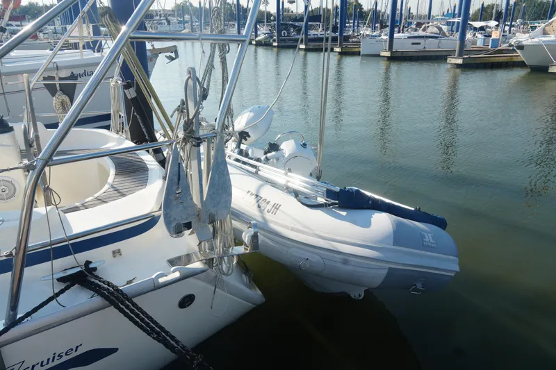 Slide: The Image of 2007 Bavaria 37 Cruiser yacht docked with inflatable dinghy attached. - 7