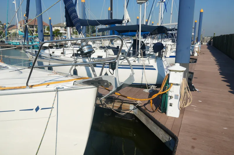 Slide: The Image of Sailboats docked at marina, featuring a 2007 Bavaria 37 Cruiser. - 8