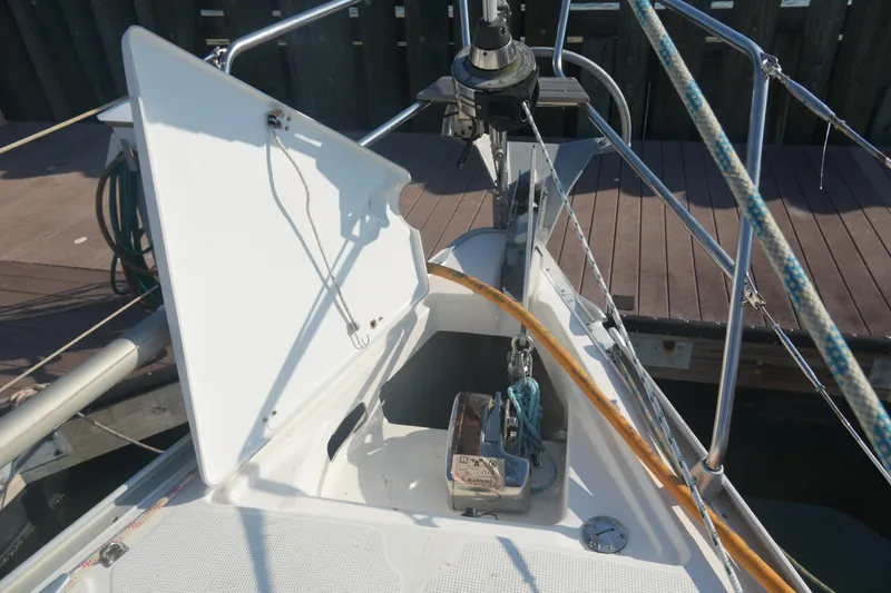 Slide: The Image of Bow of 2007 Bavaria 37 Cruiser sailboat with open anchor locker and ropes. - 9