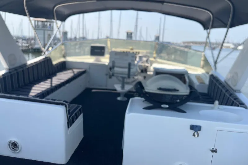 Slide: The Image of Spacious deck of 1999 Jefferson Marquessa 56 yacht with seating and grill. - 15