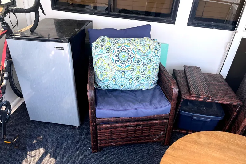 Slide: The Image of Cozy seating area on Jefferson Marquessa 56 yacht, featuring a mini fridge and patterned cushion. - 20
