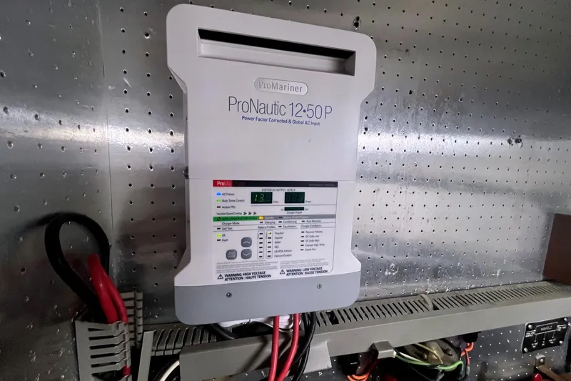 Slide: The Image of ProNautic 12-50P charger on Jefferson Marquessa 56 yacht, 1999 model, mounted on metal panel. - 28
