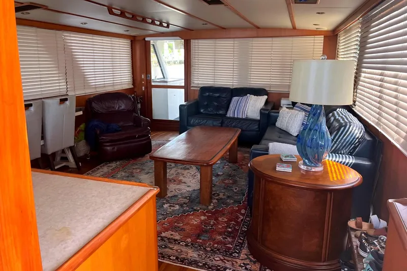 Slide: The Image of Luxurious interior of a 1999 Jefferson Marquessa 56 yacht with cozy seating and elegant decor. - 35