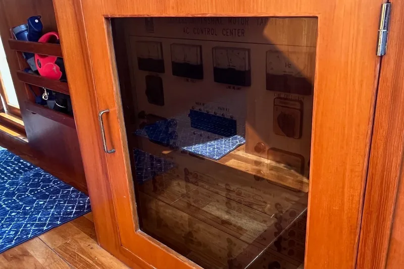 Slide: The Image of Wooden cabinet with glass door on a 1999 Jefferson Marquessa 56 yacht interior. - 40