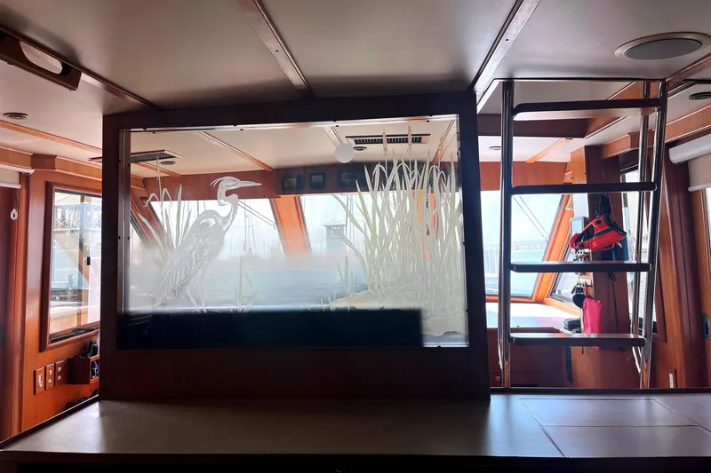 Slide: The Image of Interior of 1999 Jefferson Marquessa 56 yacht with etched glass heron design. - 42